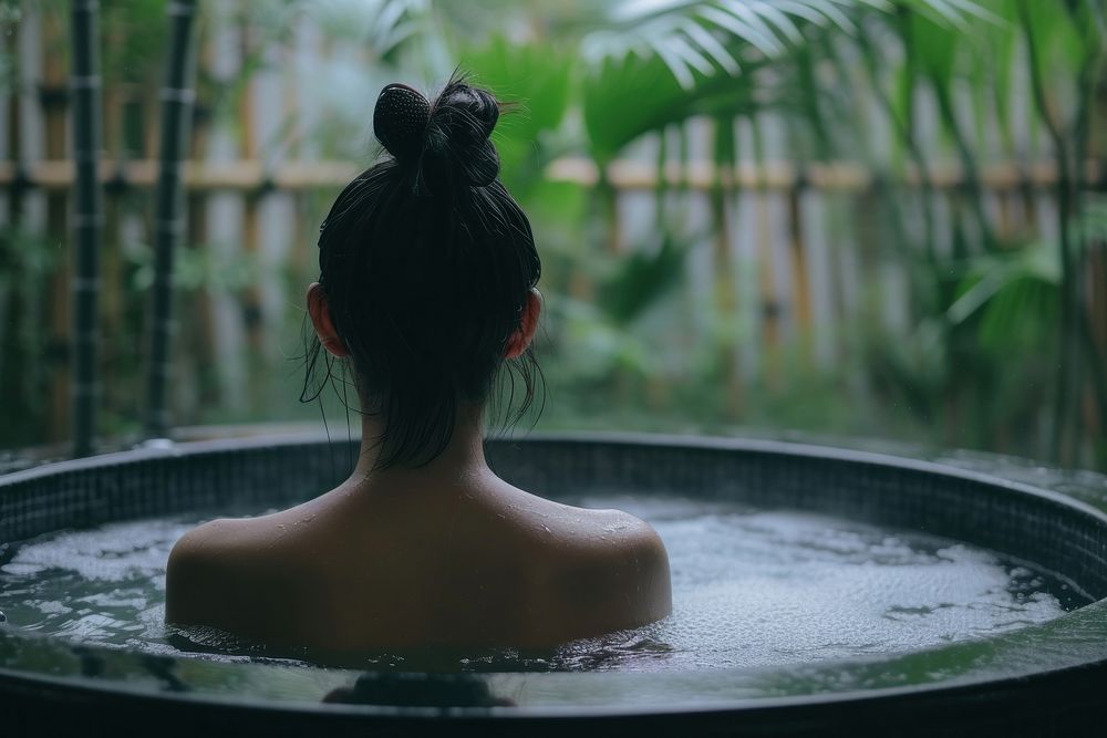 Photo of asian person in large tub adult back tranquility.