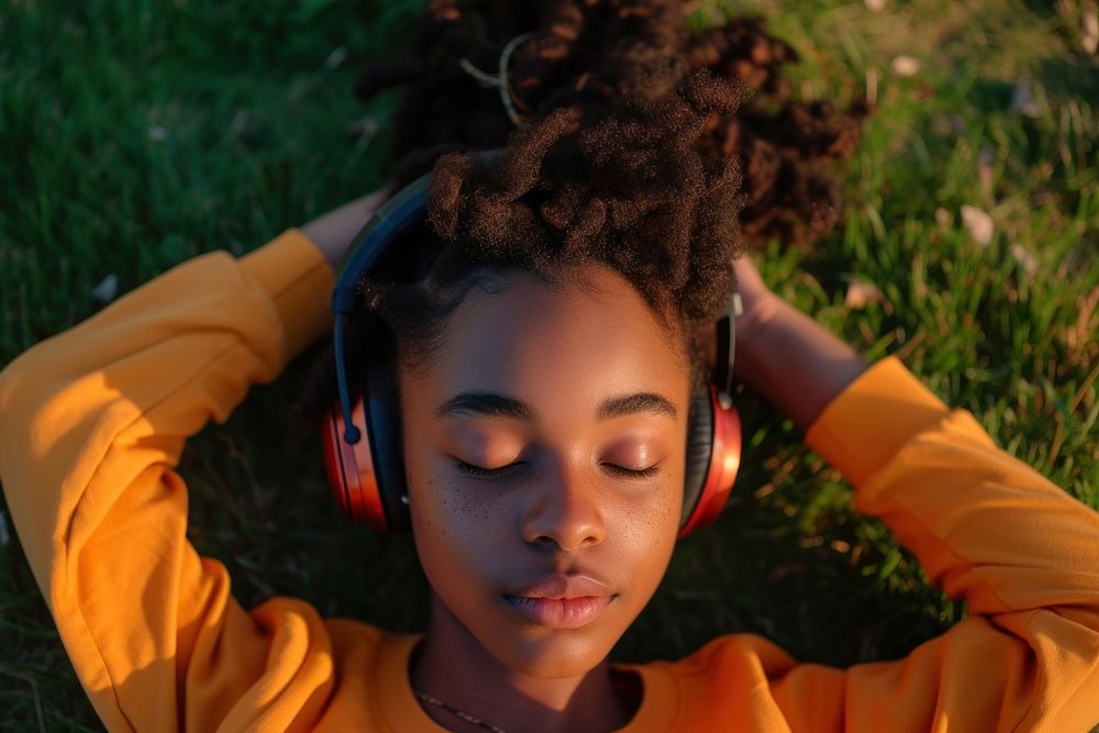 Black teen woman listening music headphones portrait headset.