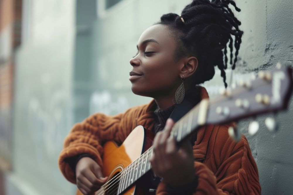 Black teen woman playing guitar musician person individuality.