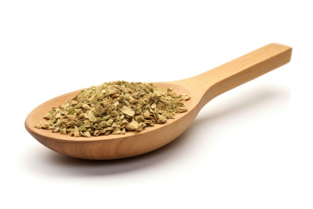 Dried oregano chopped on wooden spoon food ingredient freshness.
