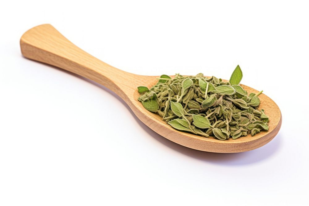 Dried oregano chopped on wooden spoon ingredient vegetable freshness.