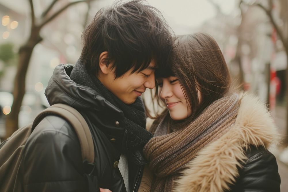 Photo of Japanese teenager couple portrait jacket scarf.
