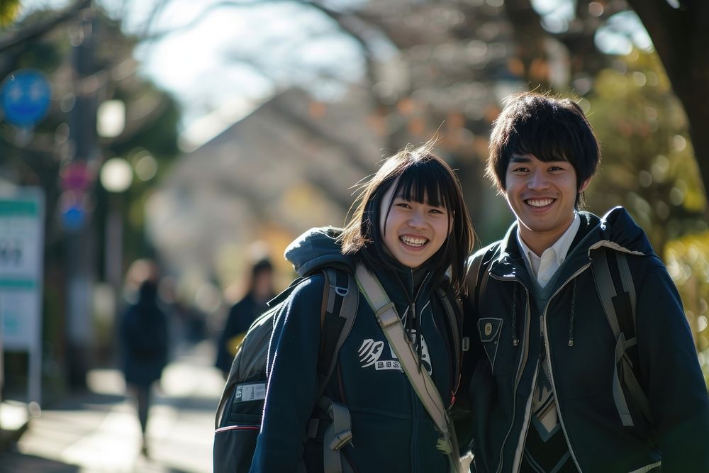 Photo of Japanese teenager couple outdoors portrait jacket.