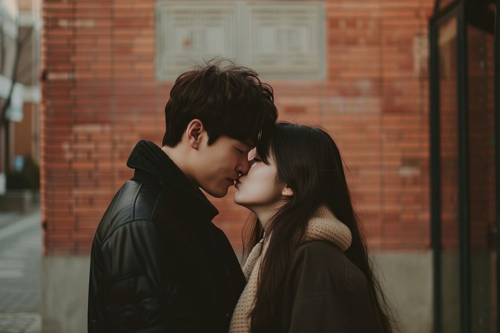 Photo of korean young adult couple kissing love men affectionate.