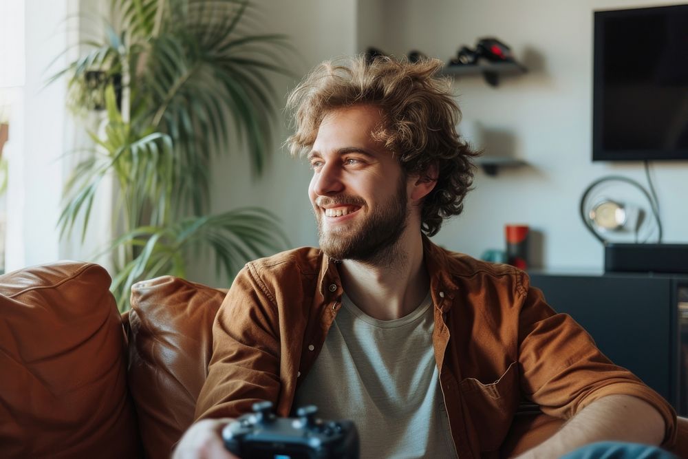 Man playing game camera person smile.