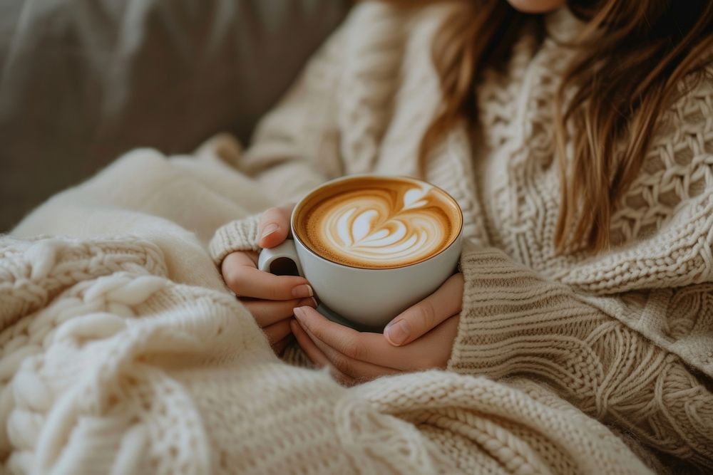 Photo of person with coffee on sofa drink refreshment comfortable.