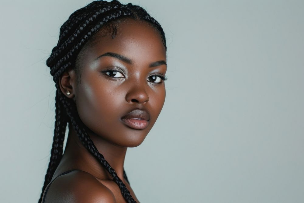 Black young woman with knotless braids hair portrait skin photography.