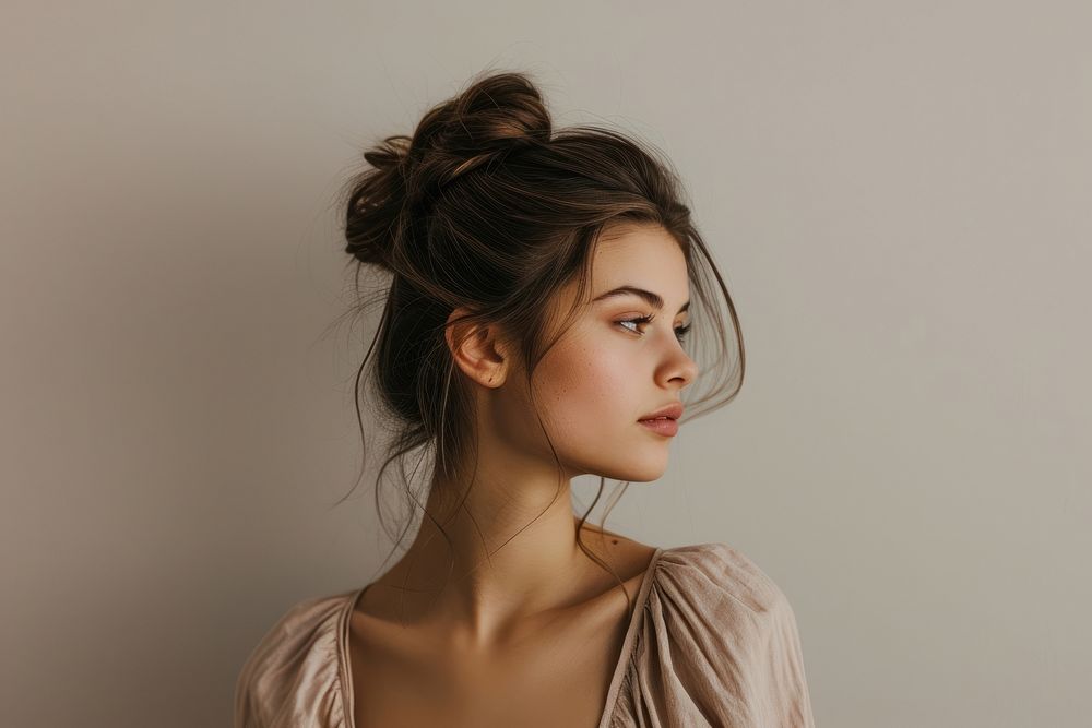 European young woman with chignon hair portrait photography fashion.