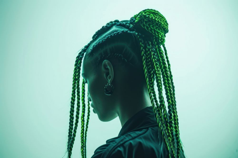 European young woman with vivid green black braids hair portrait dreadlocks silhouette.