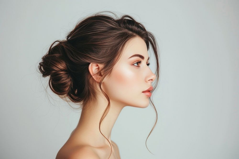 European young woman with chignon hair portrait photography fashion.