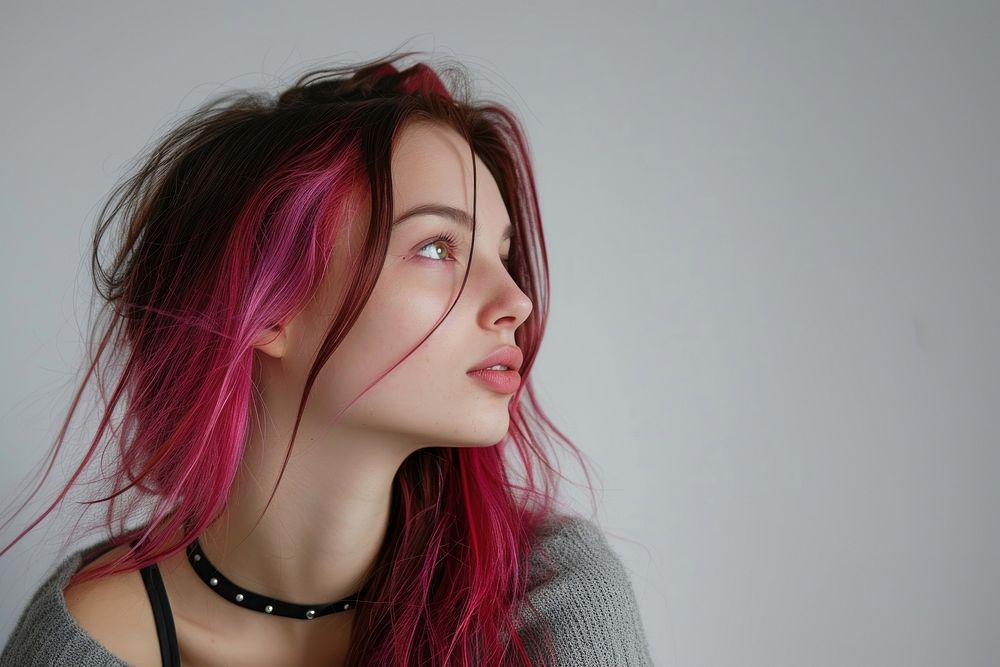 European young woman with pink black long wolf cut hair portrait fashion head.