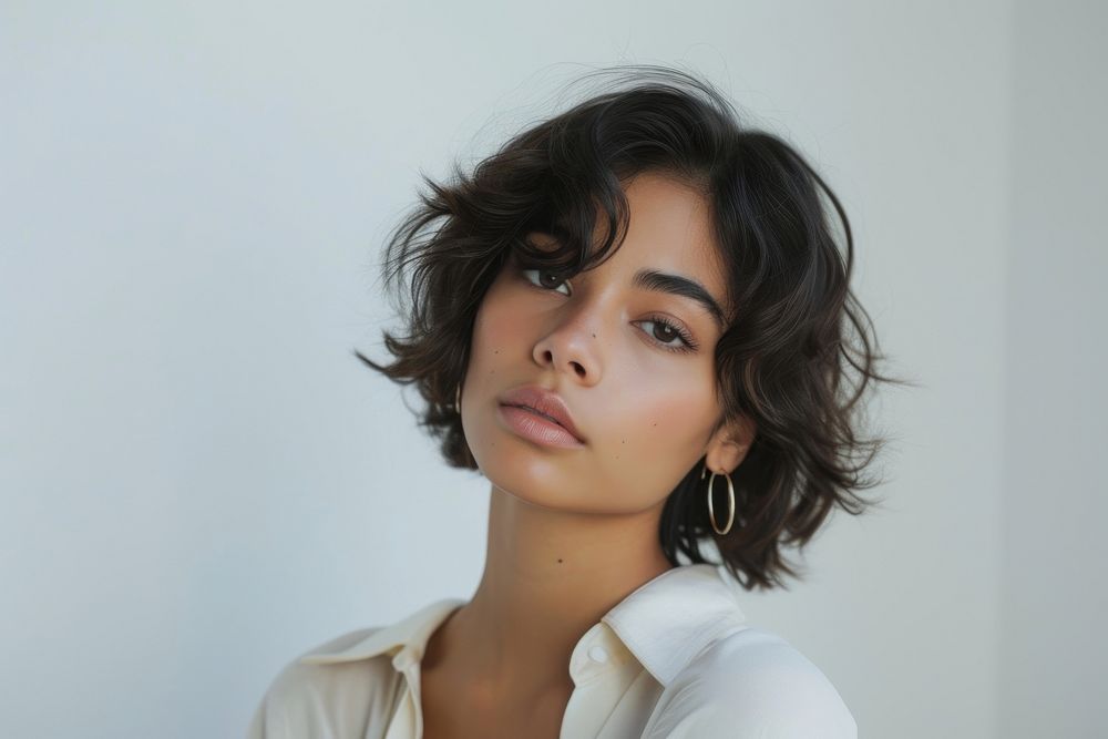 Hispanic young woman with medium wolf cut hair portrait photography fashion.