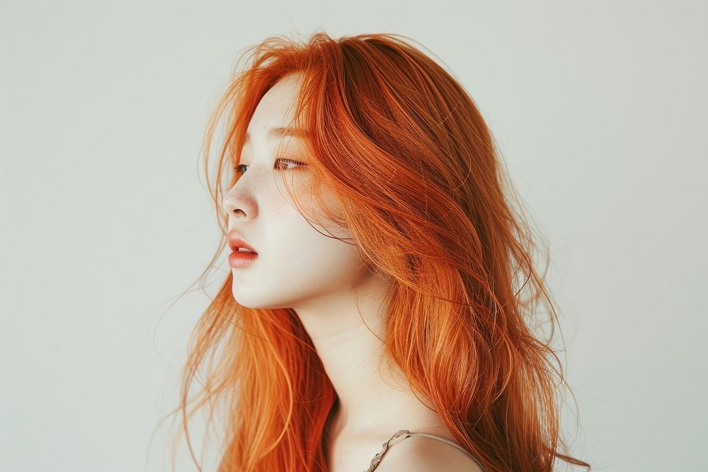 Korean young woman with orange long wolf cut hair portrait photography fashion.
