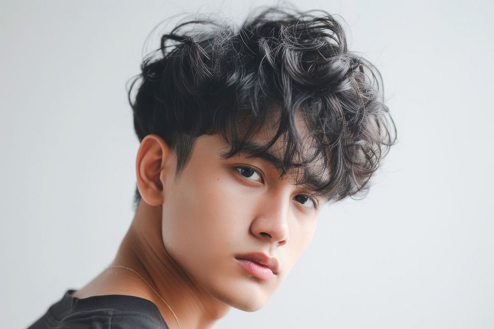 Thai young man with short wavy hair portrait photography fashion.