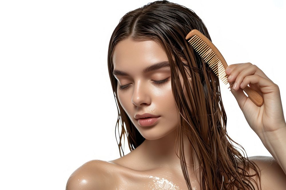 Young Female Model Putting Refreshing Mask On Long Wet Hair With Wooden Comb portrait female adult.
