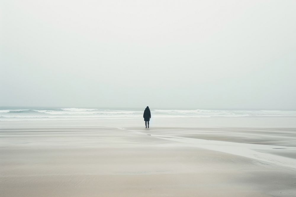 Person walking beach outdoors standing.