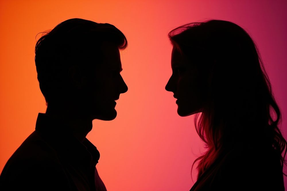 Man and woman silhouette adult photo.