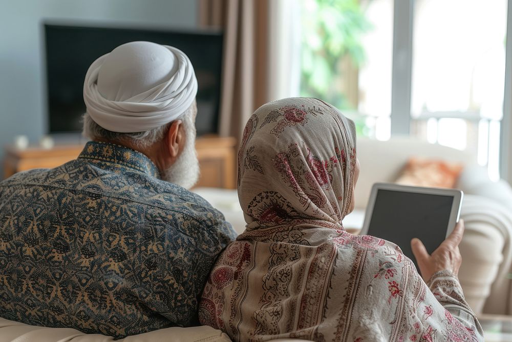 Elderly Middle eastern couple using tablet adult love togetherness.