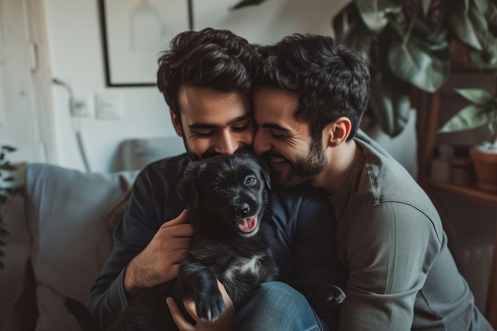 Middle eastern gay couple kiss their puppy smiling mammal animal.