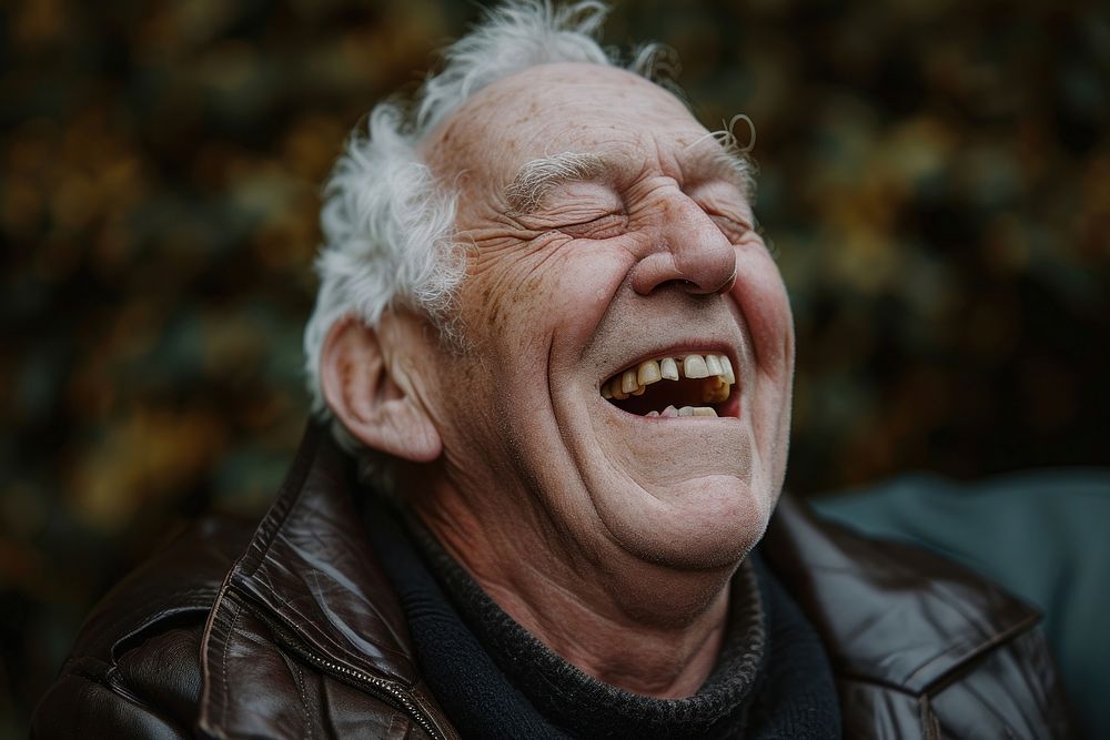 British man laughing adult eyes closed.