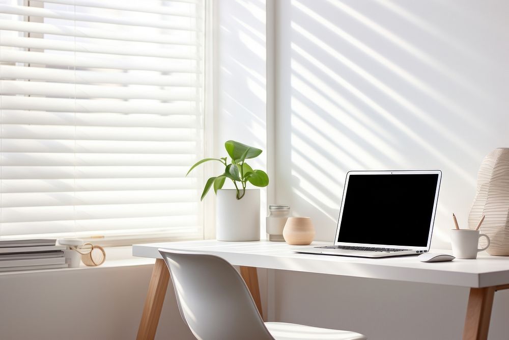 Scandinavian interior design of a home office windowsill furniture computer.