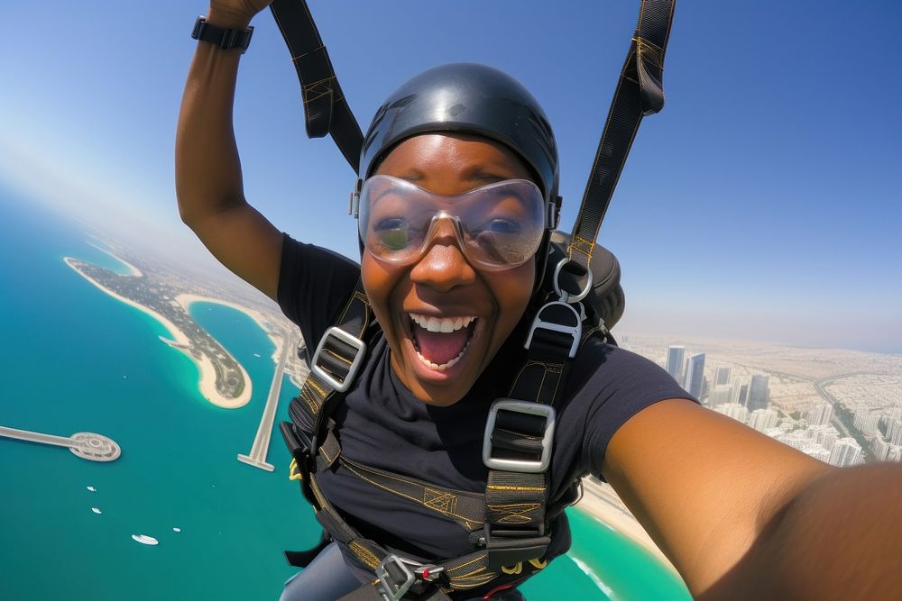 African middle age woman skydiving in dubai recreation adventure outdoors.