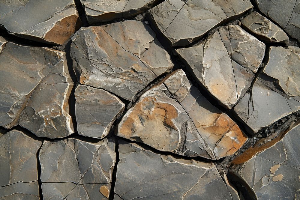 Cracked rock in the ground backgrounds flagstone textured.