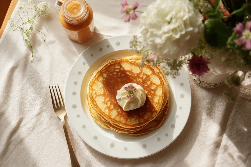 Butter pancake with milk brunch plate table.