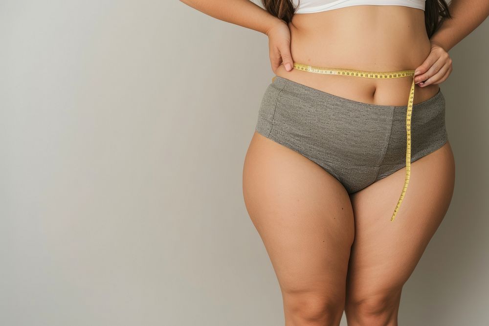 Woman measuring legs underwear lingerie panties.