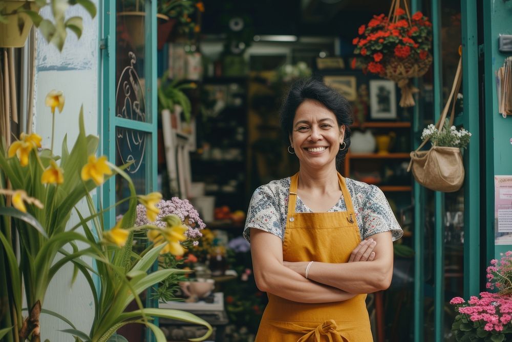 Cheerful small business owner standing smiling adult.
