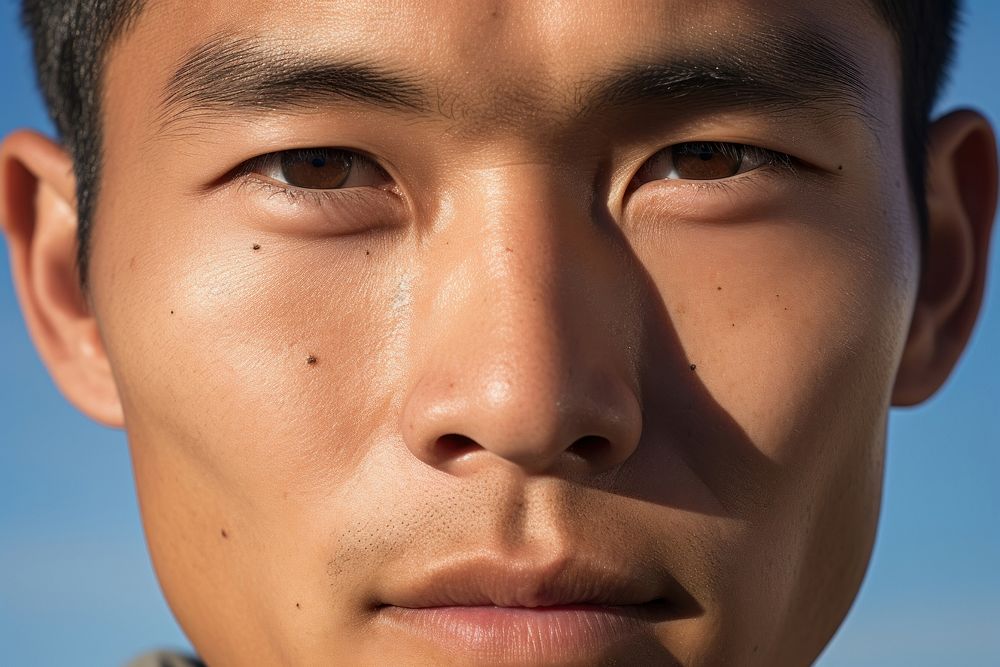 Vietnamese man outdoors skin blue.