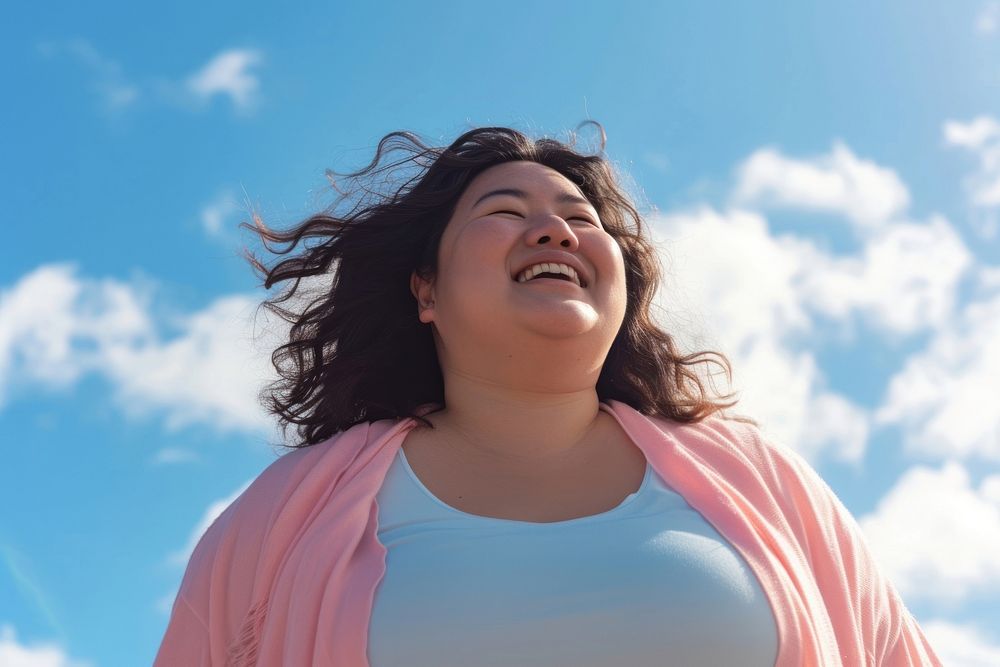 Asian plus size woman laughing outdoors female.