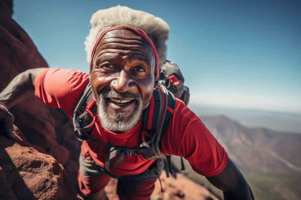 Strong mountain African senior climber recreation adventure portrait.