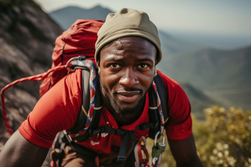 Strong mountain African senior climber backpacking mountaineering determination.