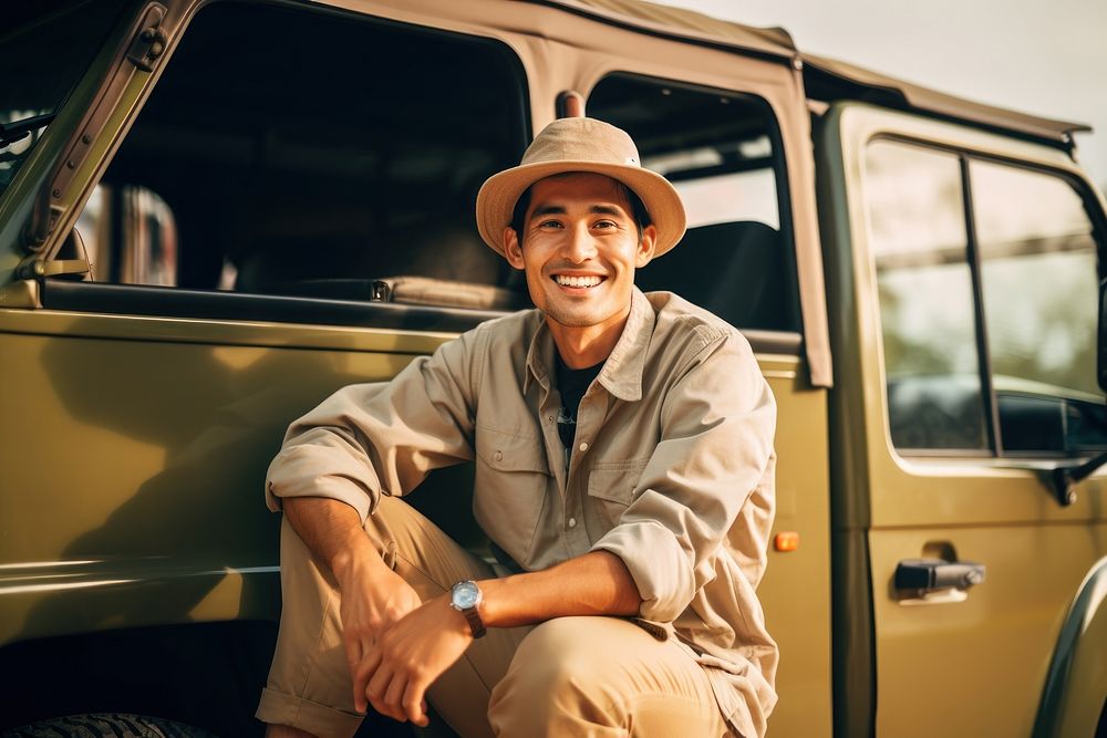 Man at safari vehicle smile standing.