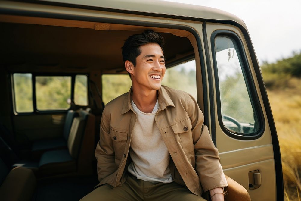 Man at safari smile standing vehicle.