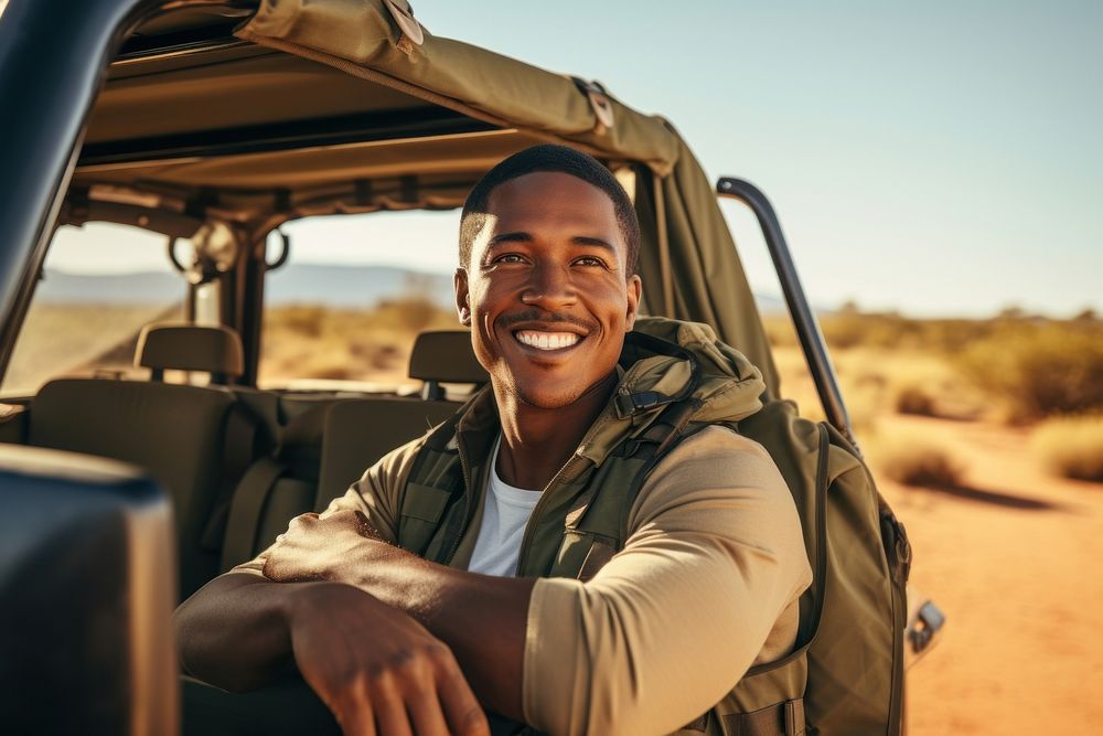 Man with safari vehicle smile outdoors adult.
