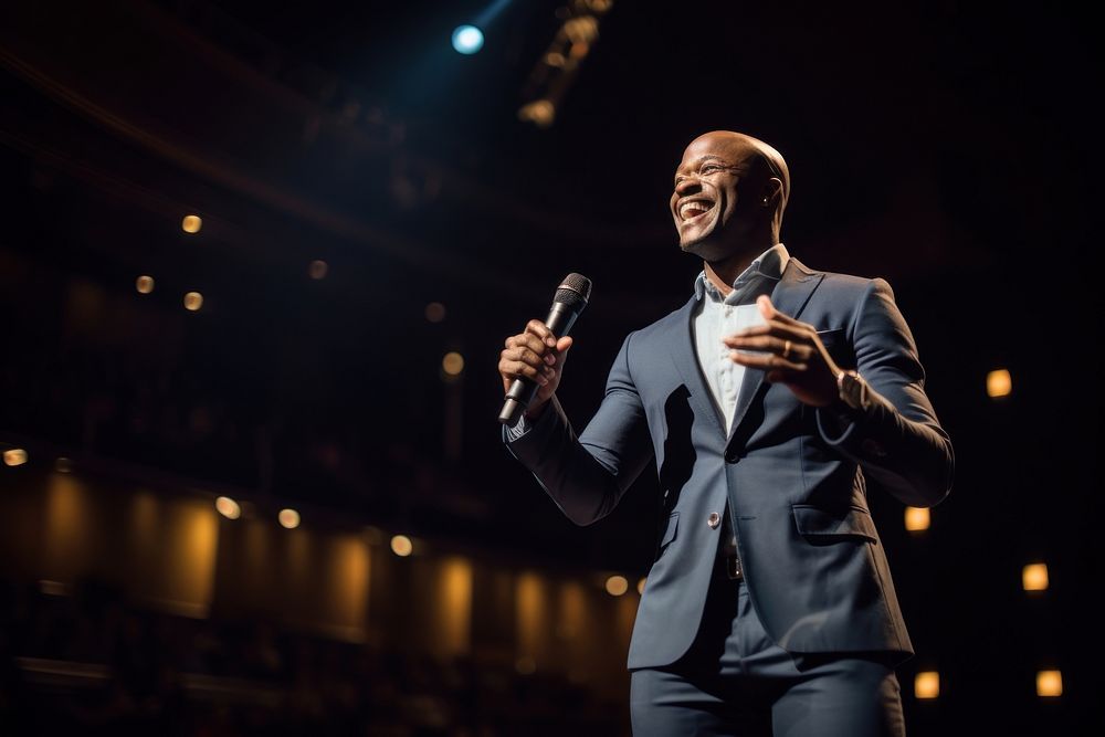 Black man speaker on professional stage microphone audience adult.