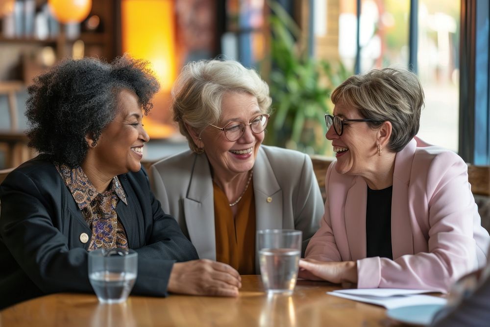 Diversity old women talk together conversation laughing glasses.