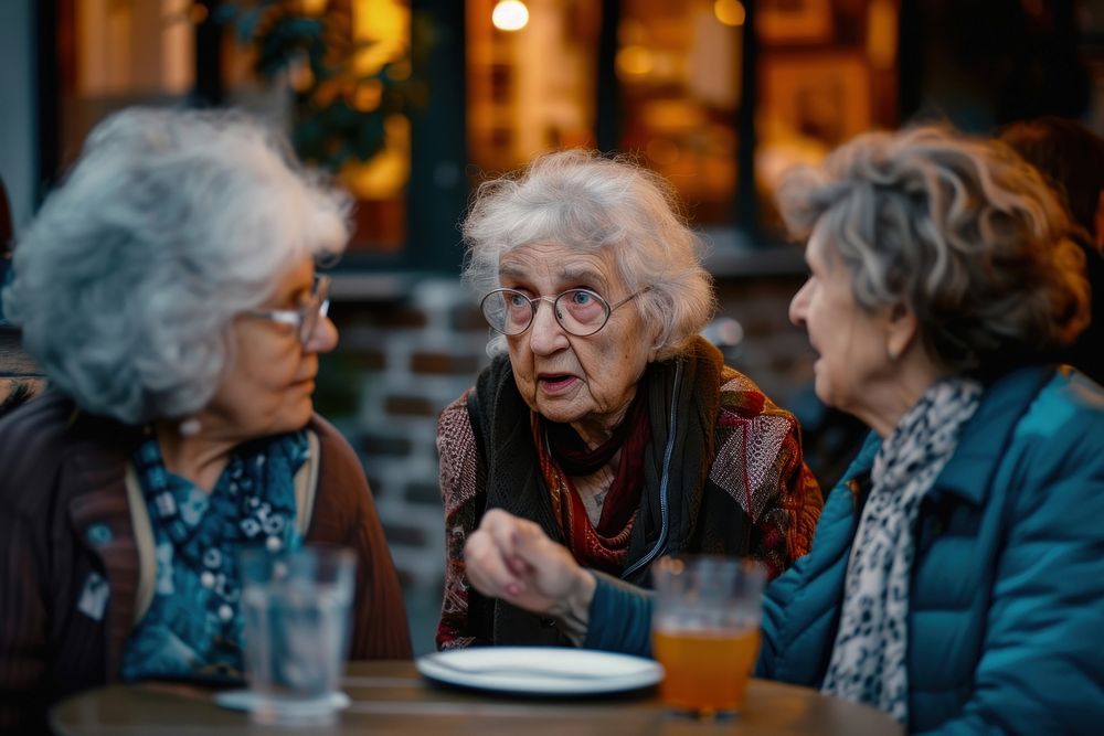 Diversity old women talk together adult table food.