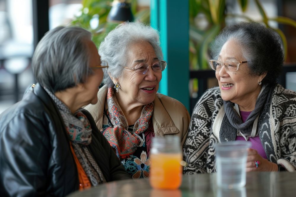Diversity old women talk together laughing adult table.