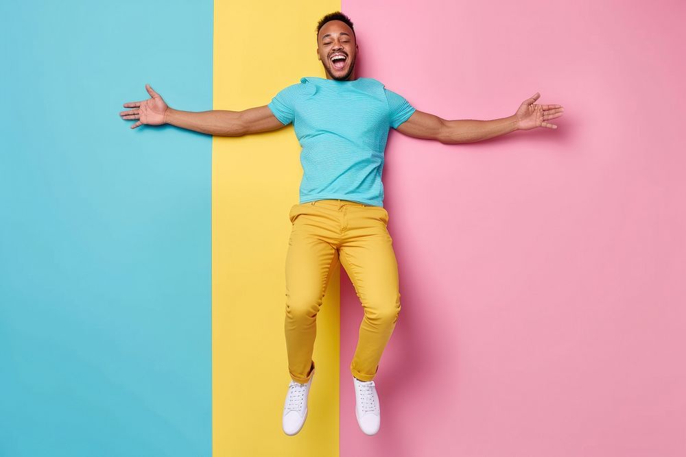 Cool LGBT young black man with fashionable clothing style full body on colored background fun excitement creativity.