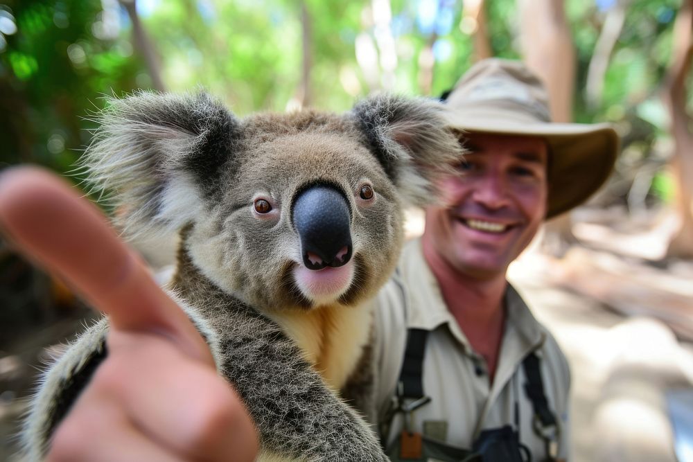Selfie of koala and zookeeper wildlife portrait smiling.