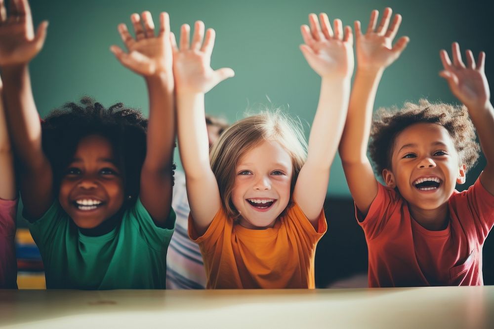 Group of diversity happy kids making high five classroom laughing child.