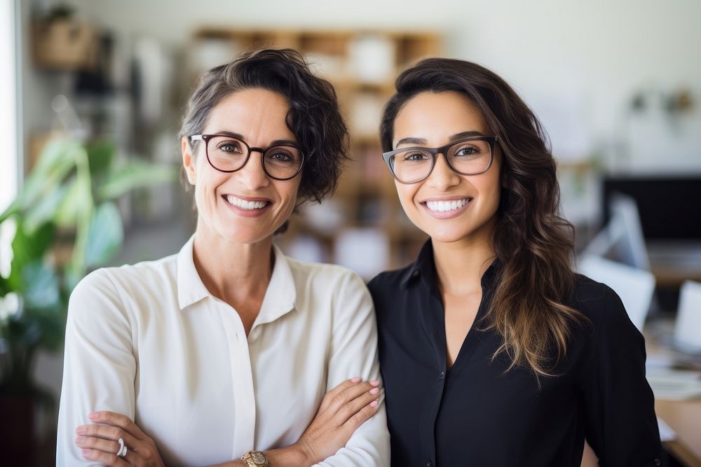 2 diverse business women smiling glasses adult.