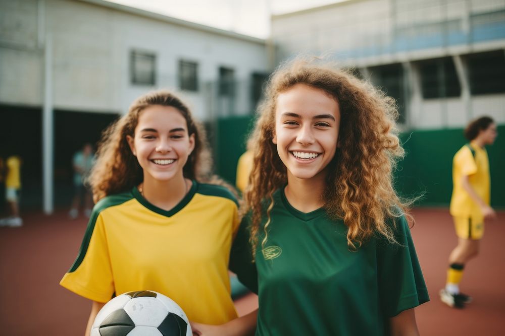 Diverse teen women wearing football team outfit soccer smiling sports.