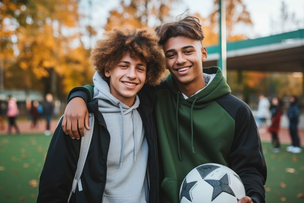 Diverse teen men wearing football team outfit smiling sports soccer.
