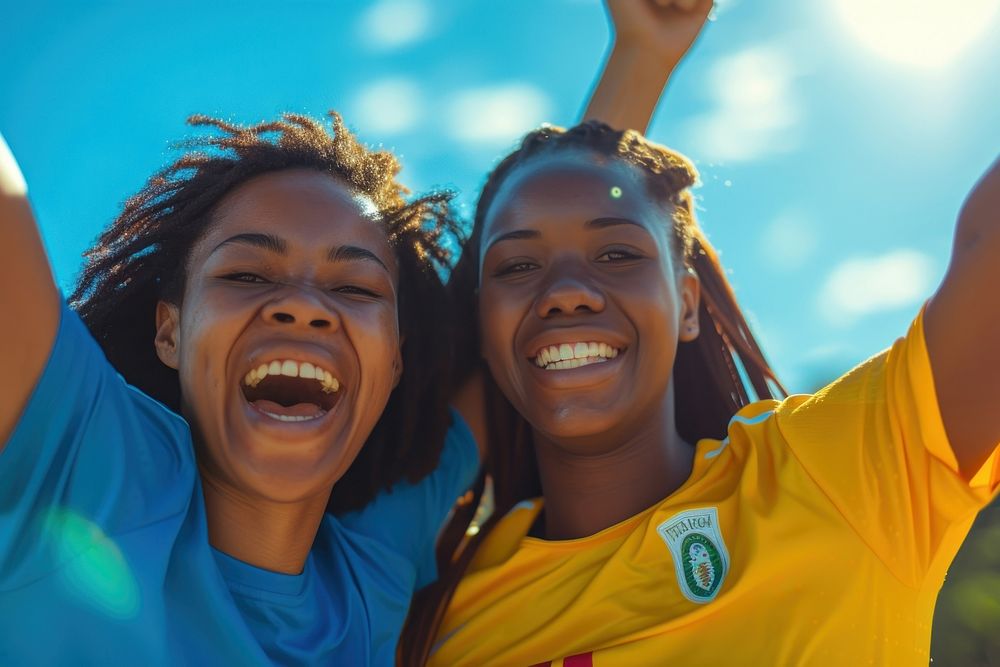 African american female soccer players laughing cheering adult.
