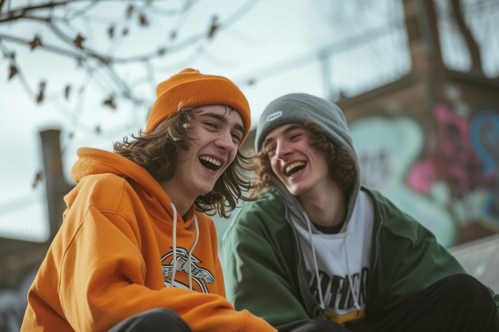 Two friends skaters laughing togetherness architecture friendship.