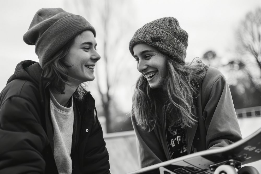Two friends skaters laughing adult smile togetherness.